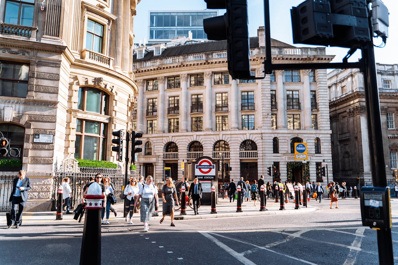 Busy cityscape of pedestrians near historic Bank Station, London.